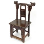 Oriental Chinese carved wooden chair with dragon supports and floral back, 90cm high : For Condition