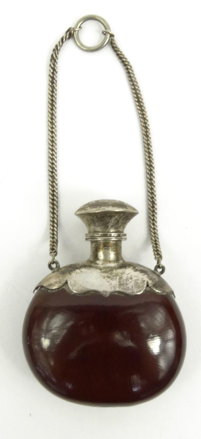 Unusual silver topped nut scent bottle on chain, 6cm long : For Condition Reports please visit www.