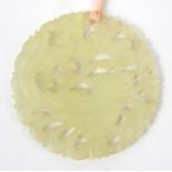 Oriental Chinese pierced jade pendant decorated with a bird, 5cm diameter : For Condition Reports