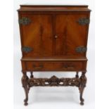 Walnut cocktail cabinet, 119cm high x 70cm wide x 44cm deep : For Condition Reports please visit