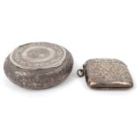 Silver vesta with floral chased decoration and a circular silver coloured metal powder pot with
