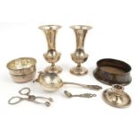 Silver items comprising pair of vases, straining spoon with bowl, miniature chamberstick and a