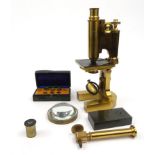 French brass microscope E. Hartnack and A. Prarmouski, housed in a fitted mahogany case, 29cm high :