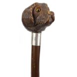 Carved nut dog's head walking stick with beaded glass eyes, 8cm long : For Condition Reports