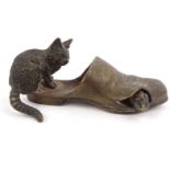 Novelty bronze model of a cat and a mouse in a shoe, impressed 'Registered' to base, 9cm long :