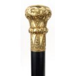 American interest ebonised walking stick with gilt metal handle, inscribed 'Presented to Geo. H.
