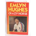 FOOTBALL; Emlyn Hughes - Crazy Horse - signed book.