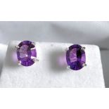 A pair of silver and amethyst earrings