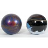 A glass paperweight by Caithness ' Meteo