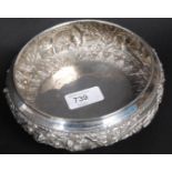 A sterling silver bowl decorated in reli