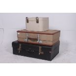 A stack of vintage suitcases to include