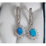 A pair of silver, opalite and CZ earring