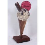 A large retro ice cream cone shop advert