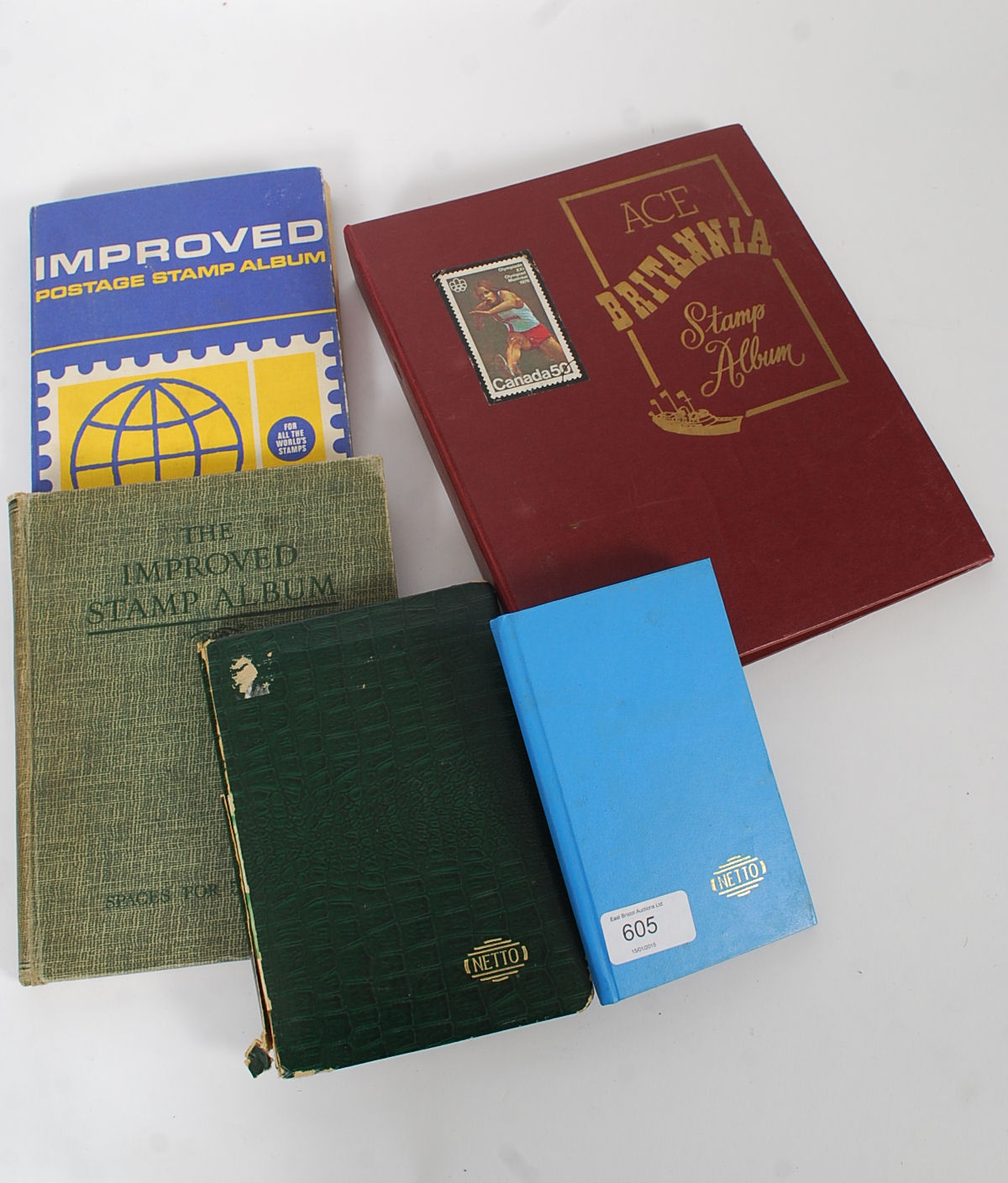 A collection of five vintage stamp album