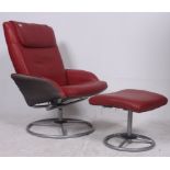 A contemporary red leather reclining and