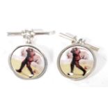 A pair of silver and enamel cufflinks de