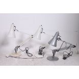 A collection of three anglepoise lamps