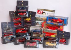 A collection of boxed diecast Ferrari ca