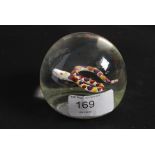 A 20th century glass paperweight in the manner of Paul Ysart having inset snake to centre