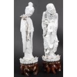 2 19th century Chinese glazed figures being raised over pierced wooden socles