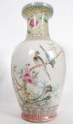 A Chinese famille rose vase of bulbous form having famille juane enamel painted neck with scenes