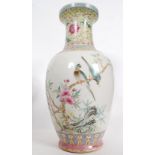 A Chinese famille rose vase of bulbous form having famille juane enamel painted neck with scenes