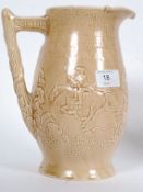A 1930`s Burleigh jug of baluster form, moulded in shallow relief with figures marrying at the