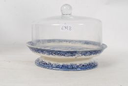 A N&D of Longton, Staffordshire blue and white raised dish having later glass cloche atop
