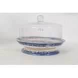 A N&D of Longton, Staffordshire blue and white raised dish having later glass cloche atop