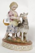 A Victorian style 20th century ceramic figure of a child and goat.