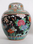 A 20th century Chinese polychrome enamel decorated ginger jar, Ironstone