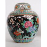 A 20th century Chinese polychrome enamel decorated ginger jar, Ironstone