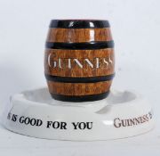 A Mintons Guinness advertising brewery combination ashtray and match holder. The centre with a