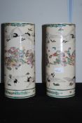 A pair of 19th century Chinese oriental hand painted cylindrical vases. Painted scenes depicting