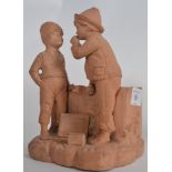 A 20th century unfinished diorama figurine of boys raised on a naturalistic plinth stamped BU426,
