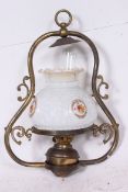 A Victorian brass hanging oil lamp with glass shade