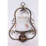 A Victorian brass hanging oil lamp with glass shade