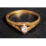 An 18k yellow gold single stone diamond,