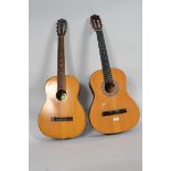 Two acoustic Spanish style six string gu