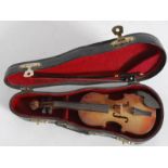 A miniature violin and box complete with