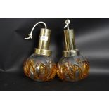 A matching pair of hanging retro lights,