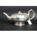 A large silver plated embossed teapot