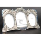 A silver plate picture frame with ditty