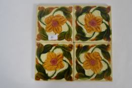 A collection of 4x Victorian tiles, each