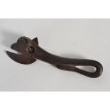 A vintage cast iron bull tin opener in t