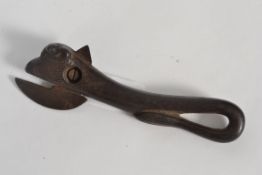 A vintage cast iron bull tin opener in t