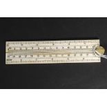 A 20th century carved bone ruler with sc