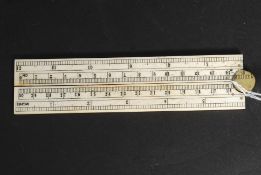 A 20th century carved bone ruler with sc