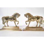 A pair of Victorian brass fireside ornam