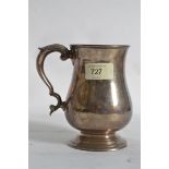 A silver hallmarked tankard with leaf de